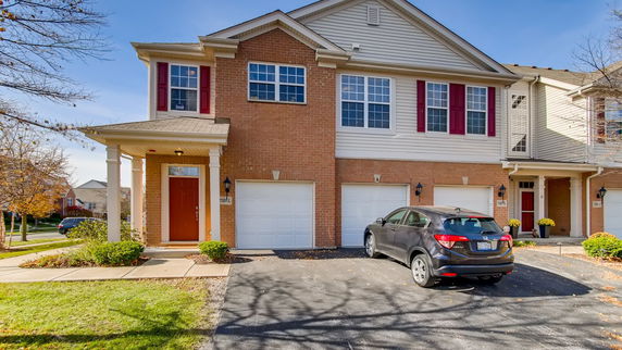 Front view of a two-story house with attached garages.