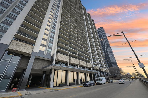 Front view of a high-rise residential building with a modern design.