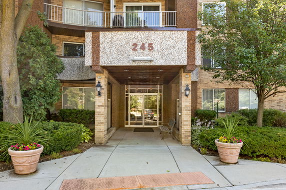Front view of a multi-story building with entrance canopy.