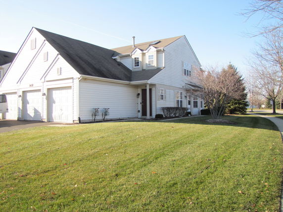Front view of a two-story house with a double garage.
