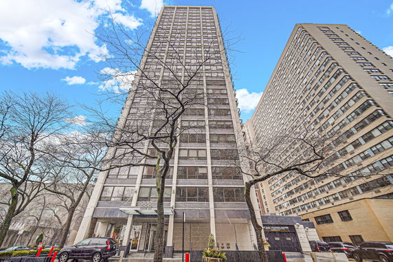 Front view of a tall residential high-rise building.