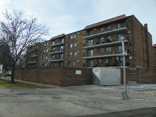 Front view of a multi-level apartment building.