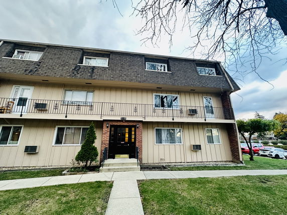 Front view of a three-story residential building.