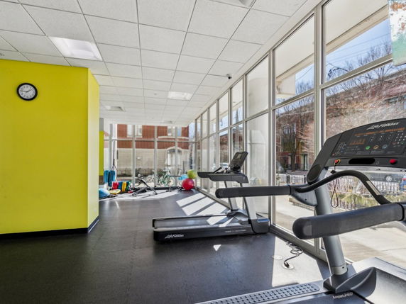 Indoor gym area with treadmills and exercise equipment.