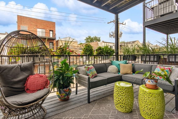 Outdoor seating area with view of neighboring buildings.
