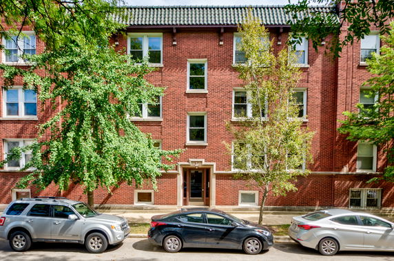 Front view of a multi-story brick building.