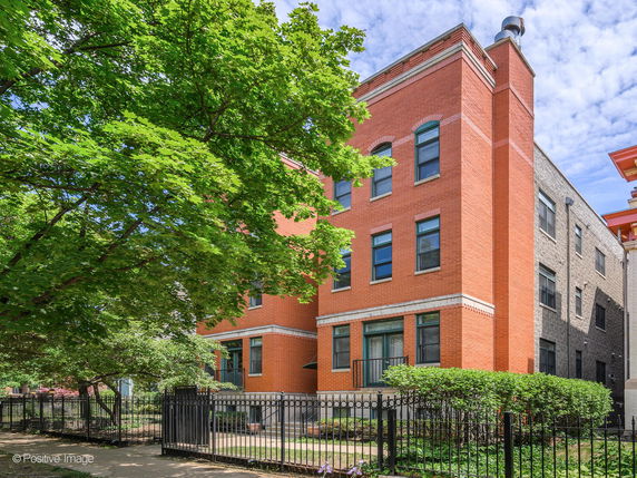 Front view of a three-story brick building.