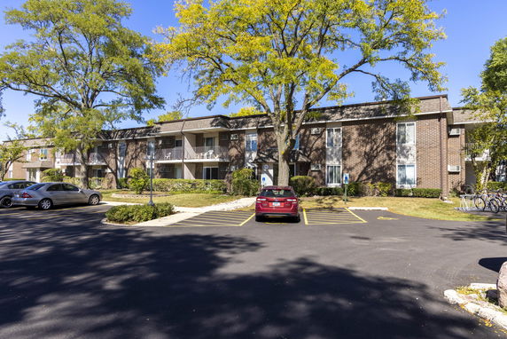 Front view of a multi-story residential building with balconies.