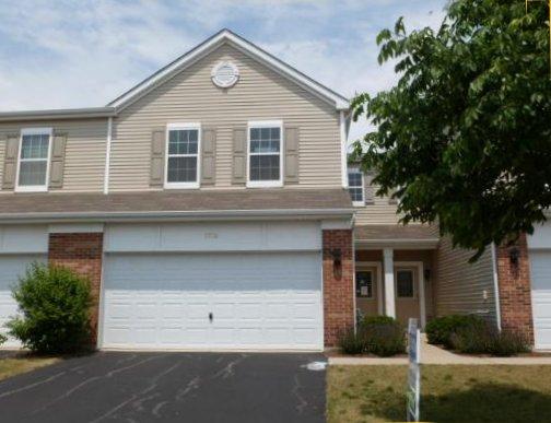 Front view of a two-story house with a double garage.