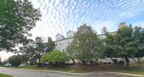 Front view of a multi-story building with gabled windows.
