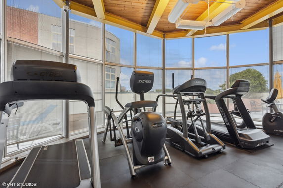 Indoor gym area with treadmills and exercise equipment.