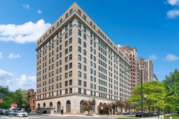 Front view of a multi-story building in an urban environment.