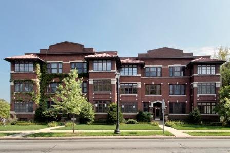Front view of a multi-story brick building.