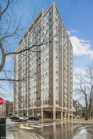 Front view of a multi-story residential building with a modern design.