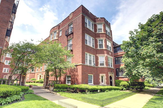 Front view of a multi-story brick building.