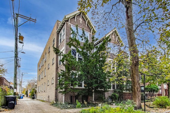 Front view of a multi-story brick apartment building