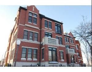 Front view of a multi-story brick residential building.