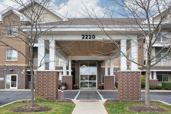 Front view of a three-story building with prominent entrance.
