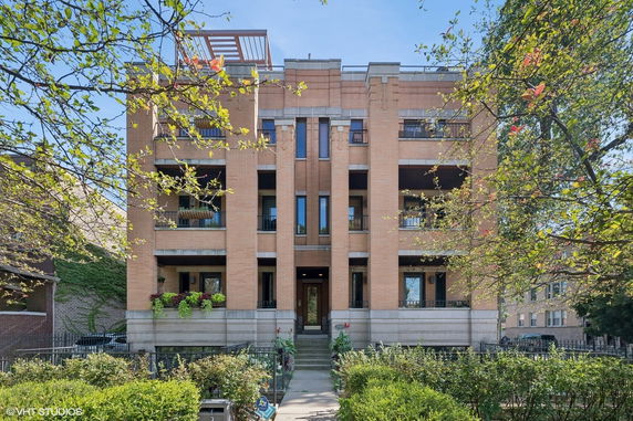Front view of a multi-story brick building.