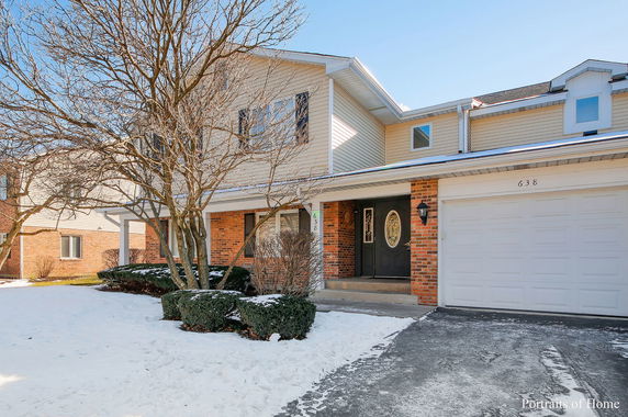 Front view of a two-story house with a double garage.