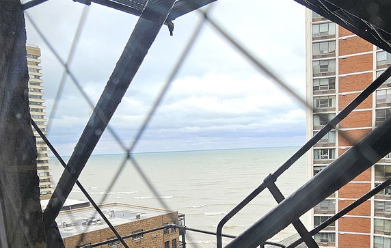Panoramic view of the sea with nearby buildings visible.