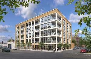 Front view of a modern multi-story building with large windows.