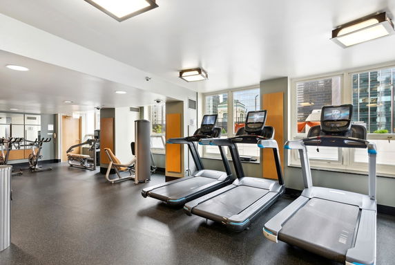 Indoor gym with treadmills and exercise equipment.