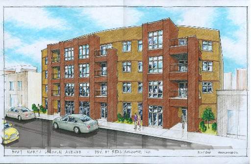 Front view of a multi-story residential building with multiple balconies and large windows.