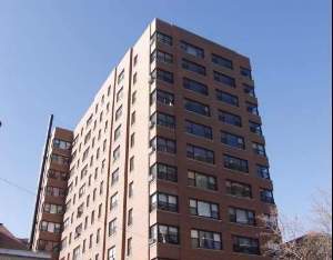 Front view of a multi-story apartment building.