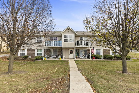Front view of a two-story residential building with balconies.