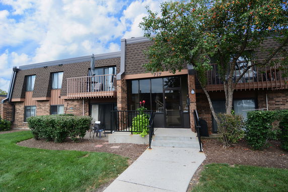 Front view of a two-story brick building with a central entrance.