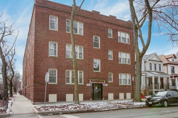 Front view of a three-story brick building.