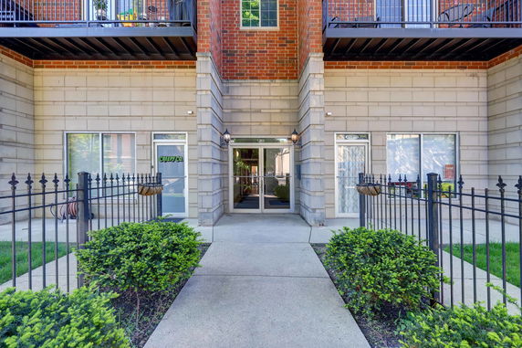 Front view of a multi-story building entrance.