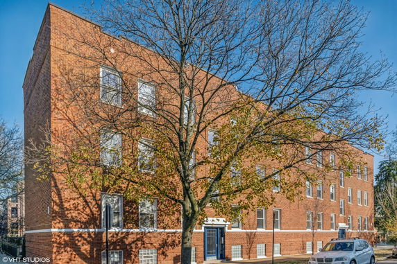 Front view of a multi-story brick building.