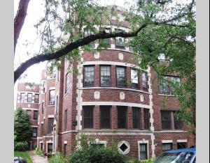 Front view of a multi-story brick residential building.
