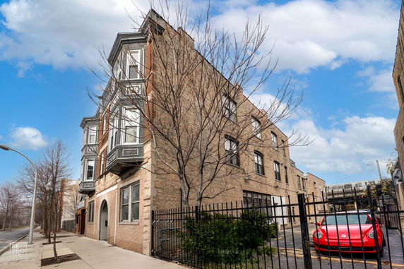 Front view of a multi-story brick building.