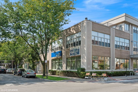 Front view of a two-story commercial building with large windows.