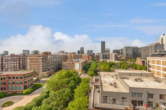 Panoramic view of urban buildings and greenery.