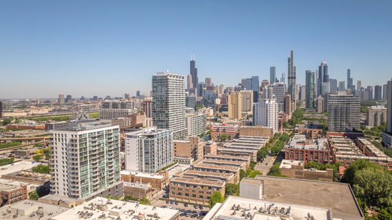 Panoramic view of a cityscape with multiple high-rise buildings.