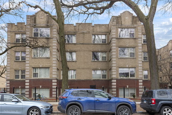 Front view of a multi-story brick apartment building