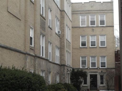 Front view of a multi-story apartment building.