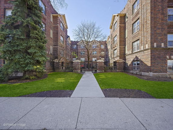 Front view of a multi-story brick residential building