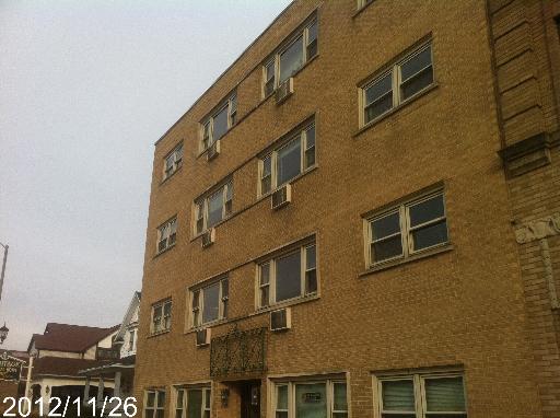 Front view of a multi-story brick building.