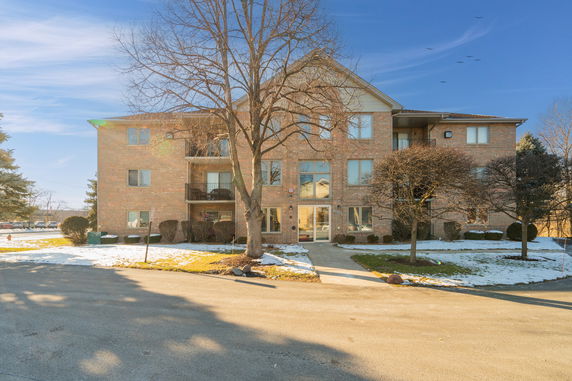 Front view of a multi-story brick building.