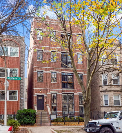 Front view of a multi-story brick residential building.