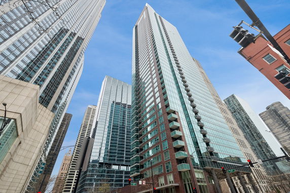 Front view of a high-rise building in a cityscape.