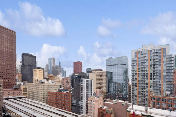 Panoramic view of urban cityscape featuring multiple high-rise buildings.