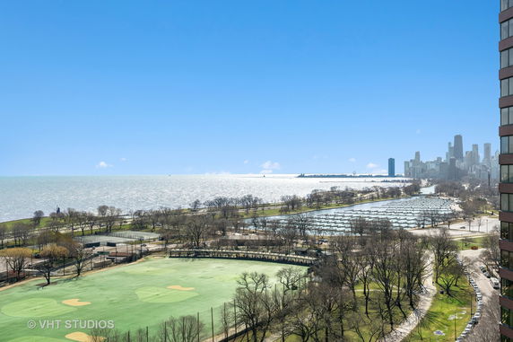 Panoramic view of a cityscape with a coastline and a park area.