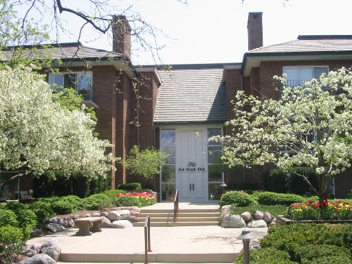 Front view of a two-story brick building with a central entrance.