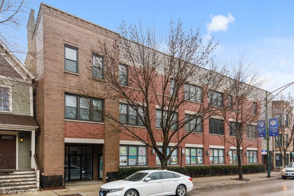 Front view of a three-story brick building.